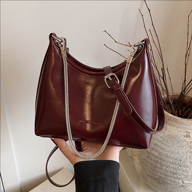 Bolso de brazo de cadena extranjera transfronteriza de invierno de mujeres 2025 nueva textura de moda bolso de hombro bolso de cara brillante