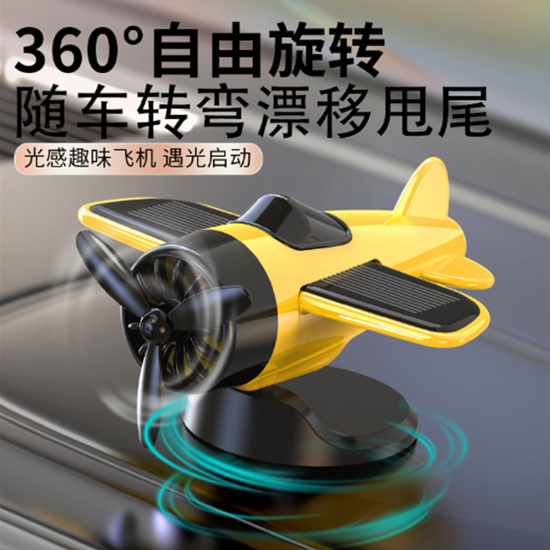 Nuevo adorno creativo de avión giratorio con energía solar para decoración del salpicadero del coche, suministros automotrices de alta gama