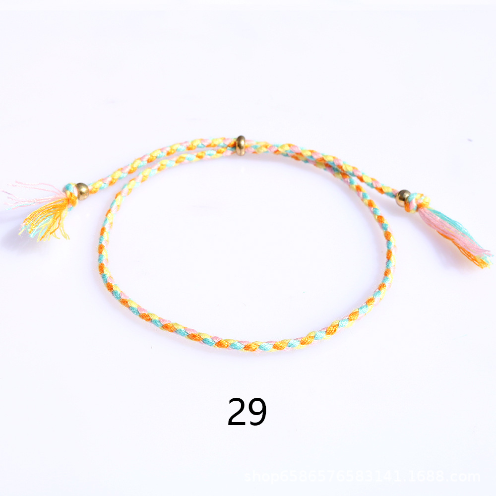 Amazon popular colorido cuerda de algodón amistad pulsera perlas de cobre borla pulsera tejida a mano ajustable hombres y mujeres pulsera