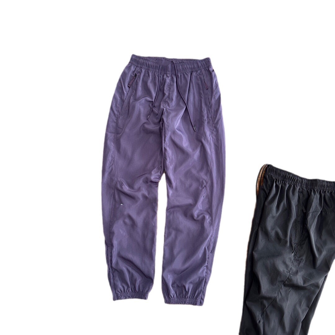 Pantalones deportivos tejidos primavera-verano pareja nuevo nylon rápido secado abrazamiento de pies tejido pantalones deportivos de doble capa para hombre