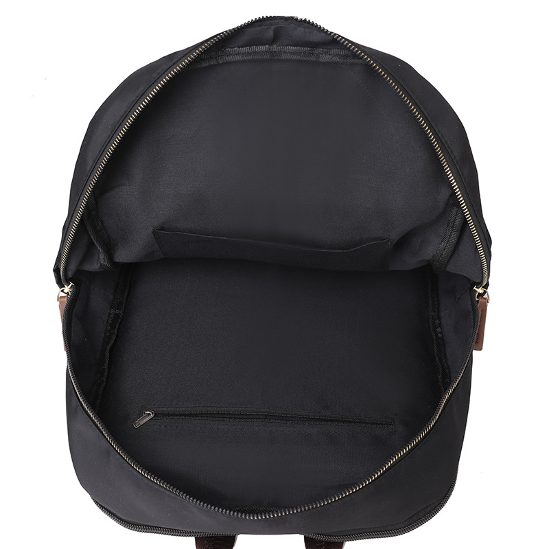 En stock al por mayor 2024 nuevas mujeres mochila de nylon simple color sólido gran capacidad ordenador mochila estudiante