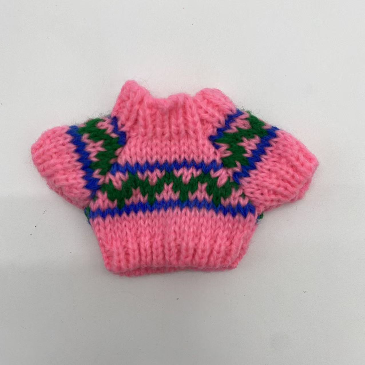 Pink sweater with green waves