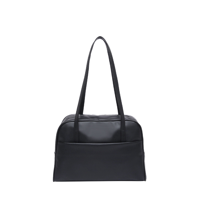 Bolso de hombro coreano de gran capacidad para mujeres 2025 primavera nuevo bolso de brazo retro estilo extranjero bolso de viento minimalista