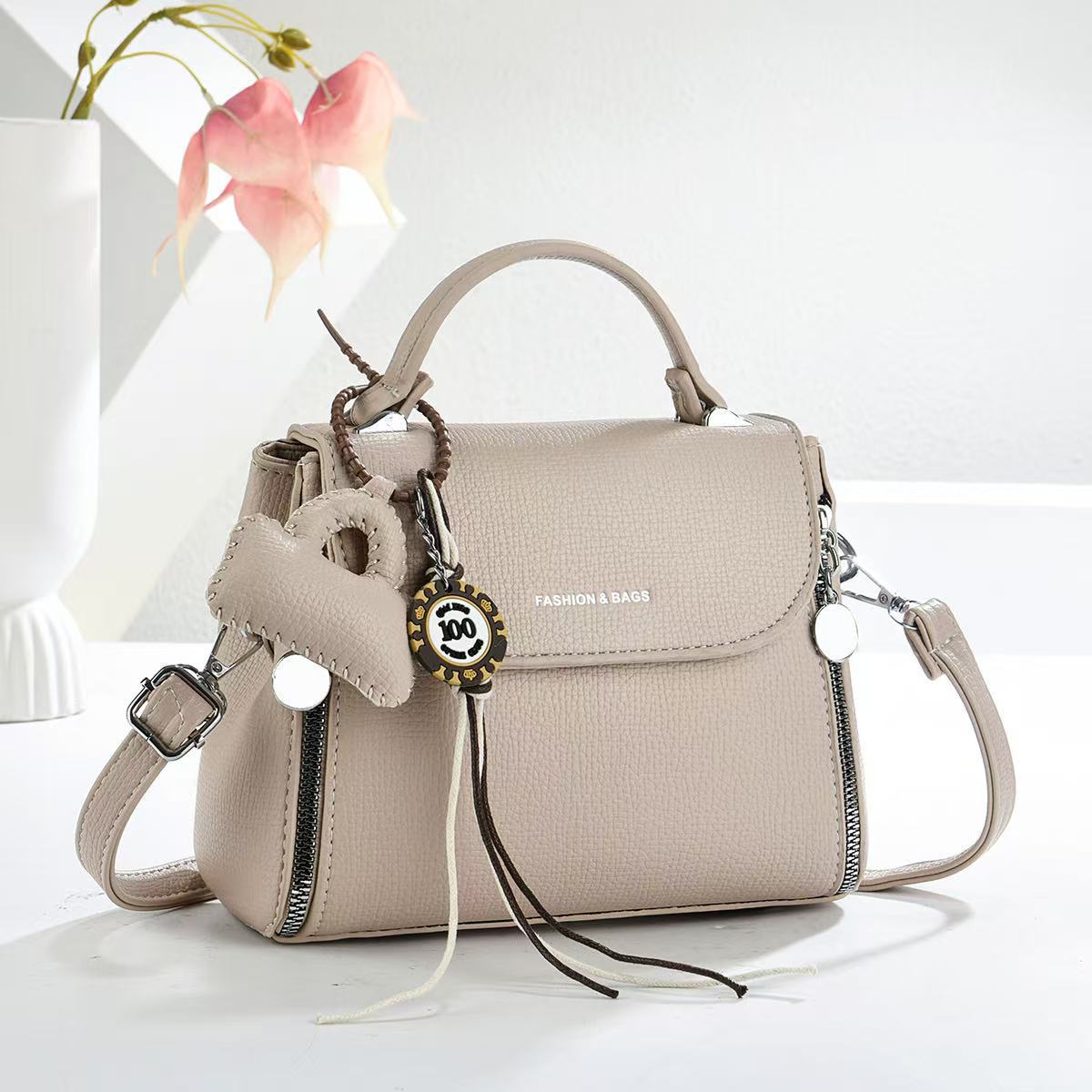 Bolsas de textura universal bolsas de mano colgantes bolsas de mano de transporte diario bolsas de hombro de moda casuales bolsas transfronterizas