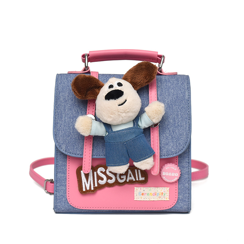2026 nueva muñeca mochila de dibujos animados mujer textura mochila portátil nicho de viaje diario lindo bolso pequeño