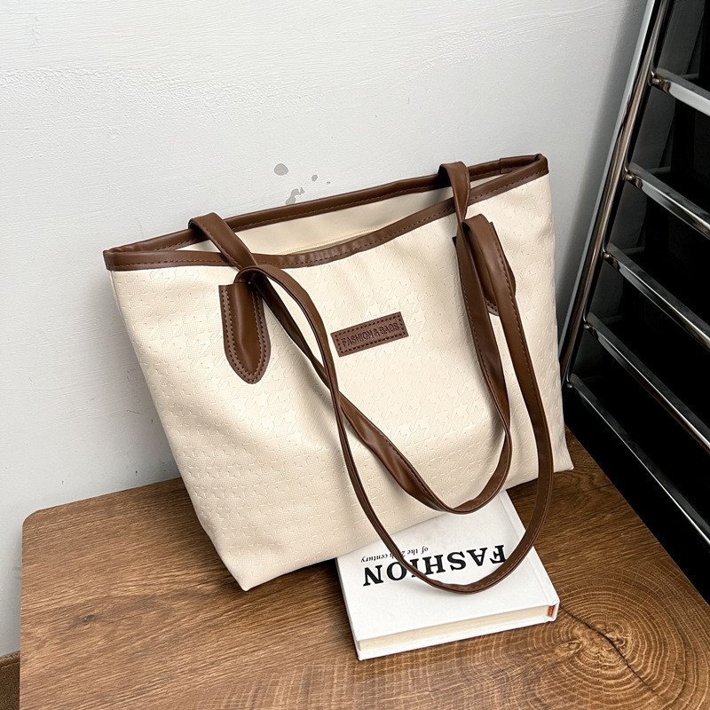 Bolsa de gran capacidad para mujeres 2024 nueva bolsa de hombro de trabajo casual, sensación avanzada de estudiantes universitarios en clase, bolsa de viaje