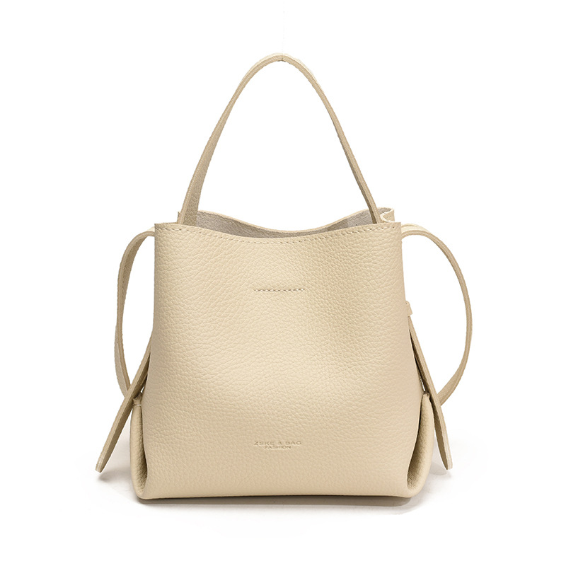 Bolso de mano de alta sensación, bolso de cubo de gran capacidad para mujeres, otoño y invierno 2025, nuevo estilo de moda bolso de hombro, bolso de mochila versátil