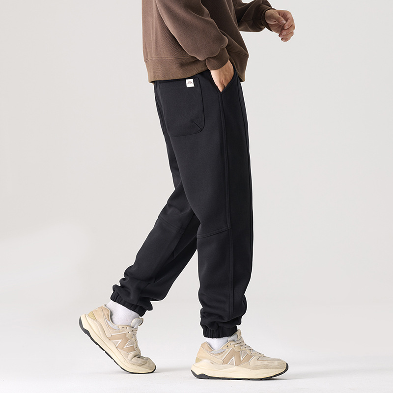 Mick Jones2025 caño hombre pantalones casuales holgados versátiles estilo coreano pantalones deportivos largos negros regulares