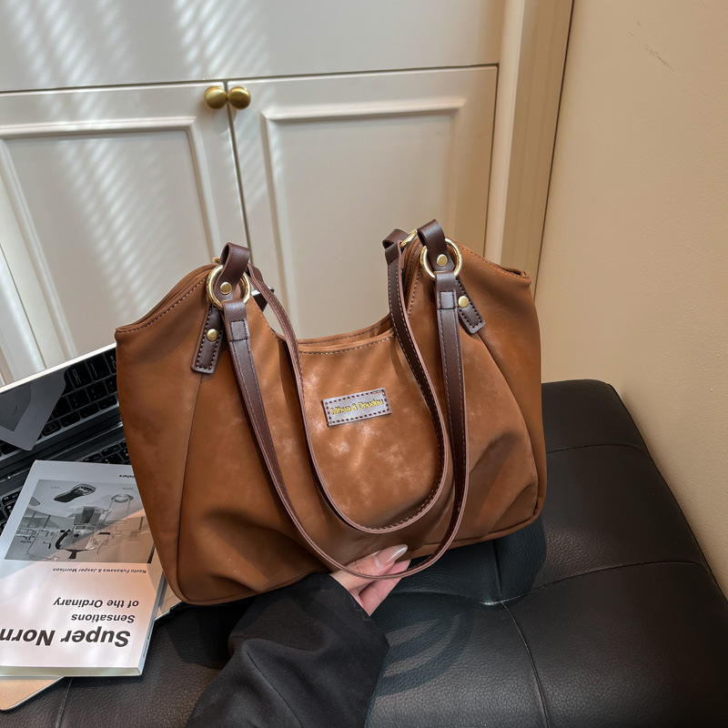 Bolsa de mano de peluche retro de gamuza para mujeres 2025 nueva moda versátil bolso de viaje tote bolso de hombro casual braza