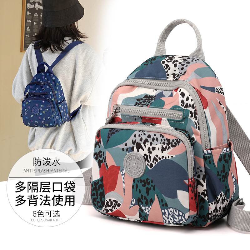 Fábrica al por mayor impermeable nylon mochila moda mujer pequeña mochila popular mediano y grande estudiantes bolsa casual