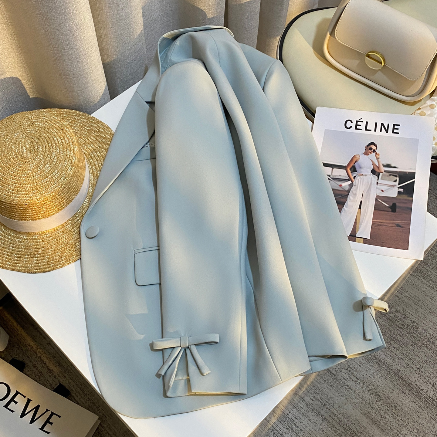 Blue elegant blazer for women, spring 2026 new style, unique bow design on cuffs.