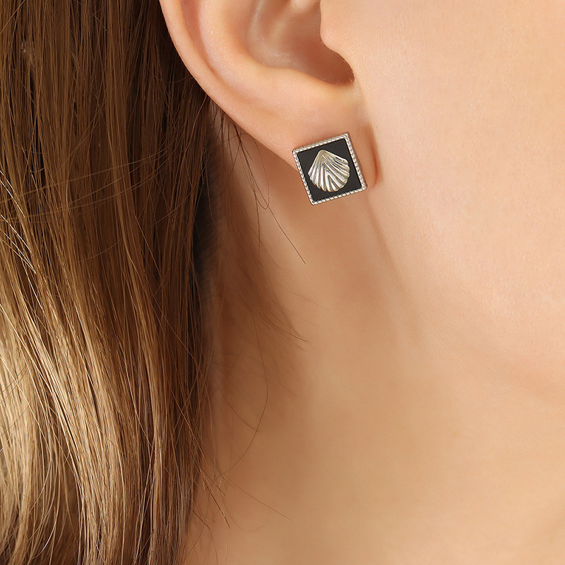 Temperamento francés incrustaciones de acrílico en relieve colgante collar personalidad pendientes moda titanio acero joyería traje