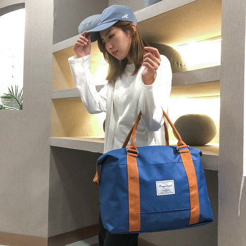 Manufacturer wholesale new travel bag LOGO shoulder bag large capacity short distance handbag luggage bag foreign trade wholesale