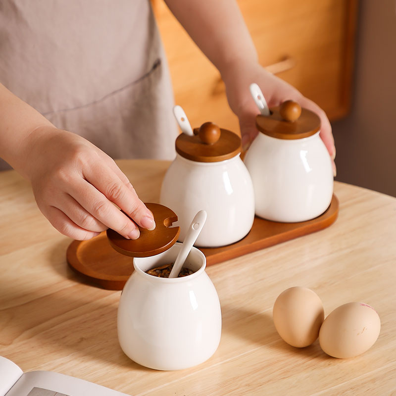 Tanque de condimento de cocina caja de condimento doméstica lata de sal botella de condimento de cerámica lata de condimento combinación conjunto de frasco de arroz y frasco de arroz