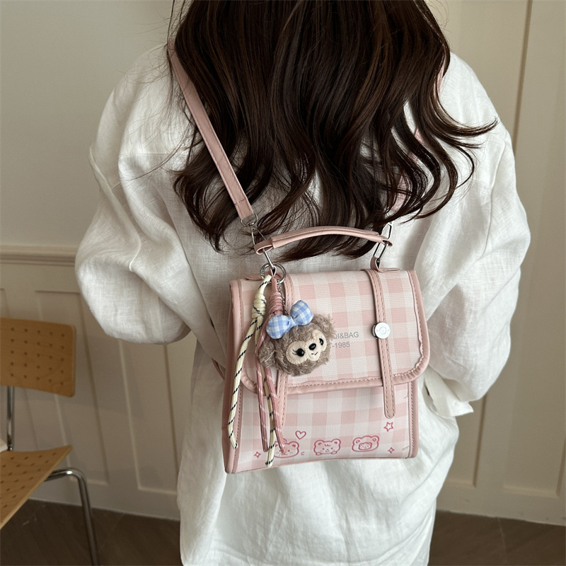 Modelo coreano de moda retro estriado mochila de hombro mujer2026 textura alta temperamento versátil mochila casual
