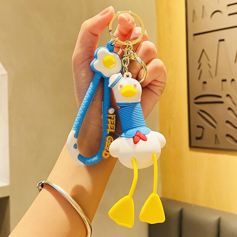 Llavero de cuello telescópico creativo de dibujos animados Divertido colgante de bolsa de descompresión colgante de coche cadena anillo pequeño regalo al por mayor