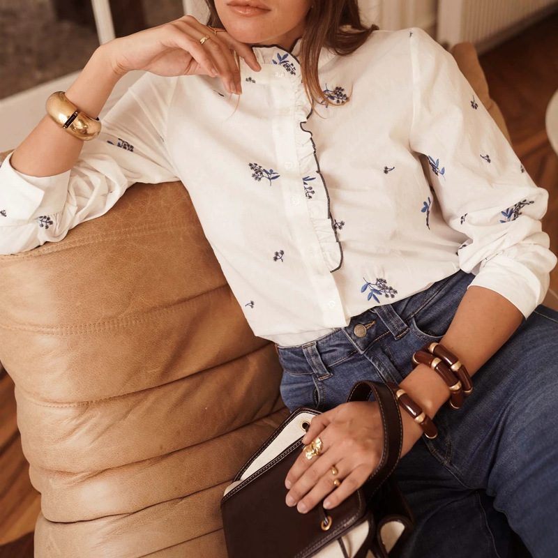 New spring and autumn collection: French-style embroidered blouse for women, featuring a stand-up collar, lace trim, and long sleeves, made of pure cotton. A stylish European and American women's top New spring and autumn collection: French-style embroidered blouse for women, featuring a stand-up collar, lace trim, and long sleeves, made of pure cotton. A stylish European and American women's top