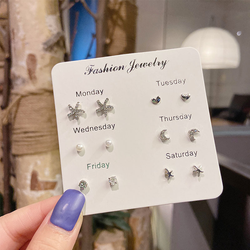 Pendientes de aro lisos para mujer, lujo ligero, pendientes de alta gama, pendientes populares, aretes de diseño exclusivo, aretes de otoño e invierno al por mayor