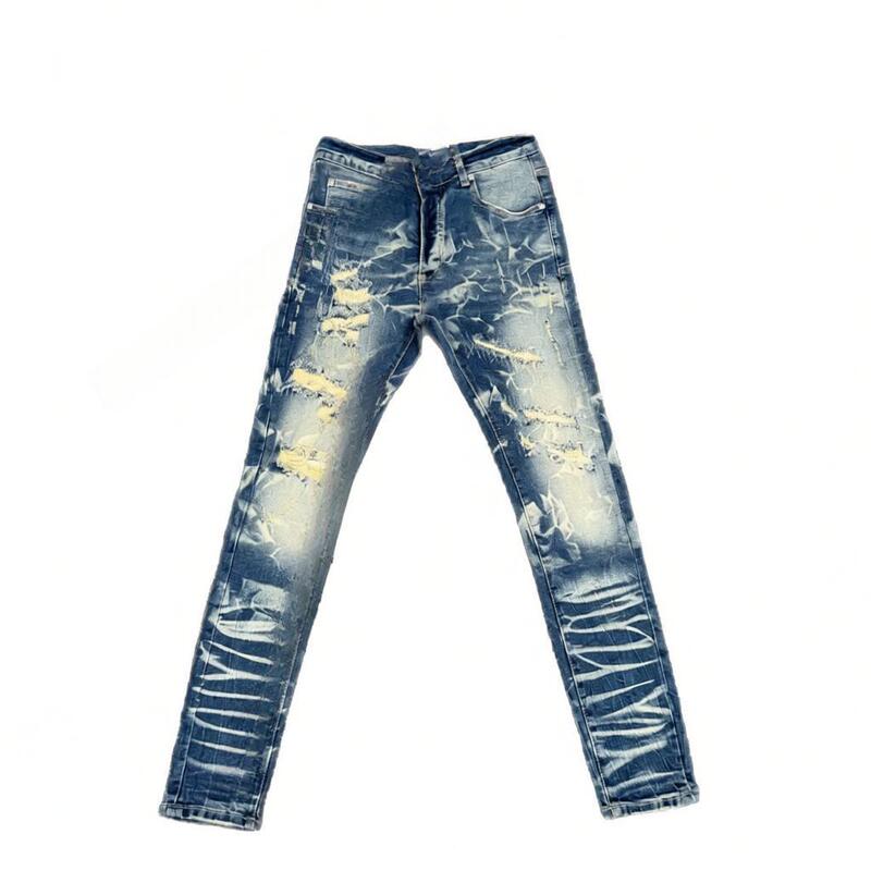 New autumn/winter collection: retro high-street style, distressed and washed denim jeans with a slightly flared leg, suitable for both men and women