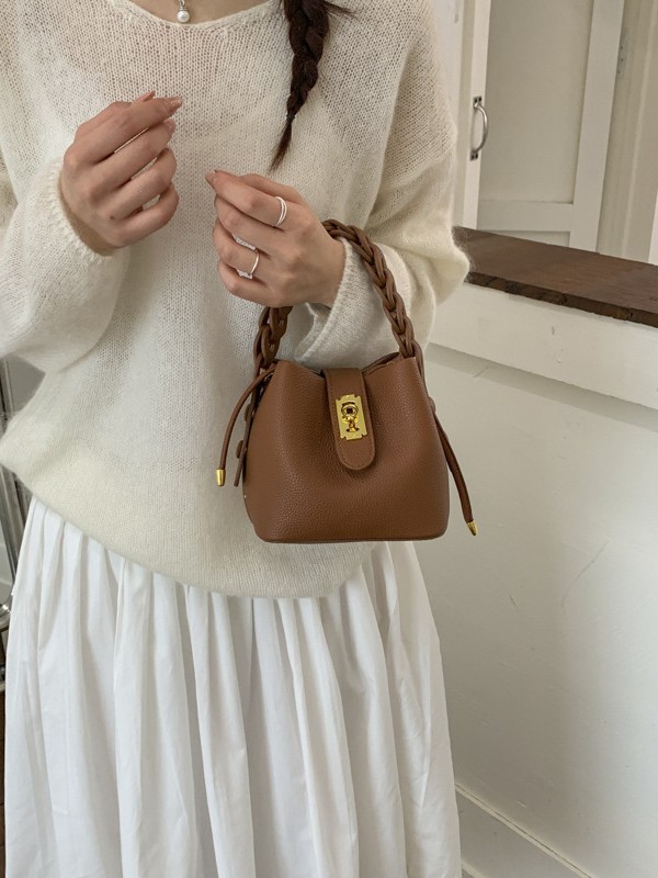 Bolsos de balde portátiles de alta calidad para mujeres 2026 verano nuevo lichi estampado viaje diario ocio versátil mochila
