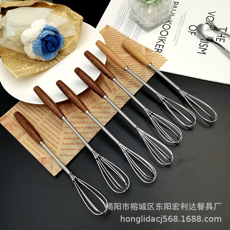 新商品の鶏の羽の木の柄のステンレスの卵を割る器は軽くて豪華な風があります。|undefined