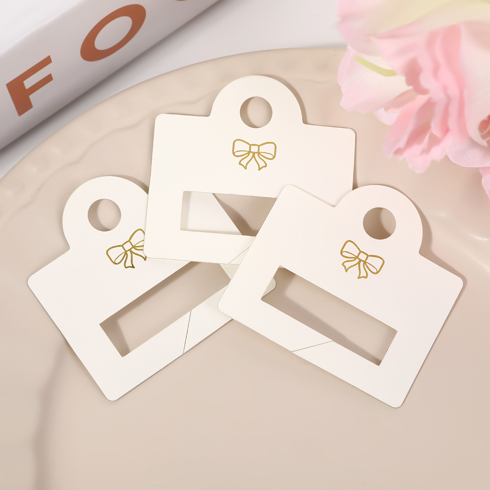 Nuevo clip de tiburón pegatinas de PVC agarrar agujero tarjeta clip para el cabello adornamiento de cabello exhibición colgante cartón de embalaje universal