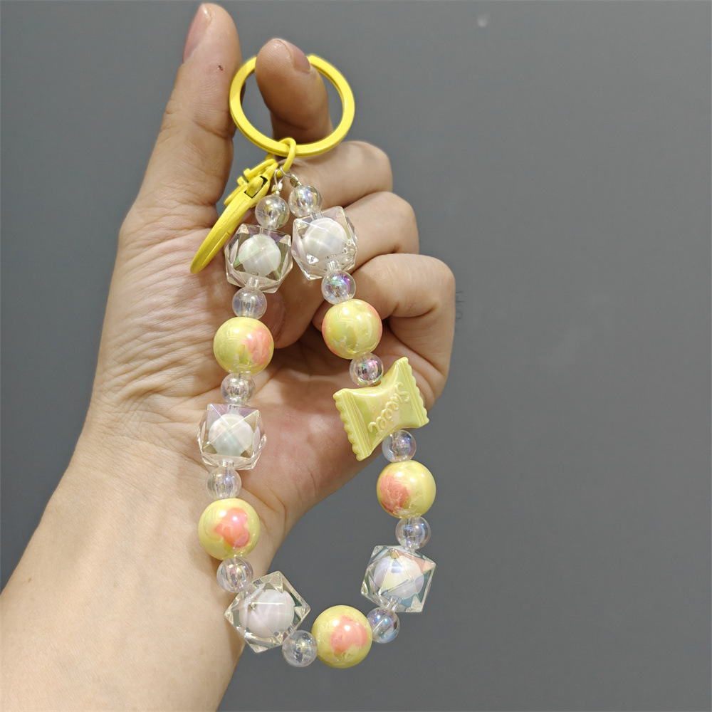 Xiaohongshu mismo estilo bicolor colorido cadena de teléfono móvil bolso de cadena de cuentas hecho a mano caja de teléfono colgante llavero al por mayor