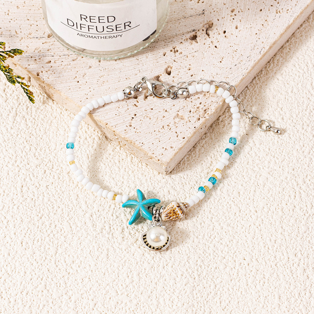Bracciale con perline e stella marina gioiello da spiaggia_voghion.com