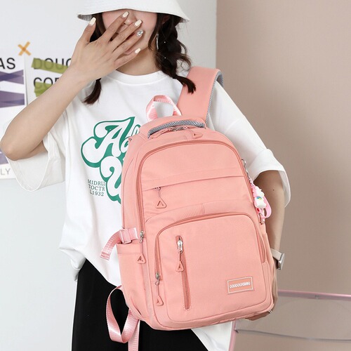Cross-border large-capacity schoolbag for junior high school students, pure color casual backpack, multi-compartment travel bag, fashionable schoolbag