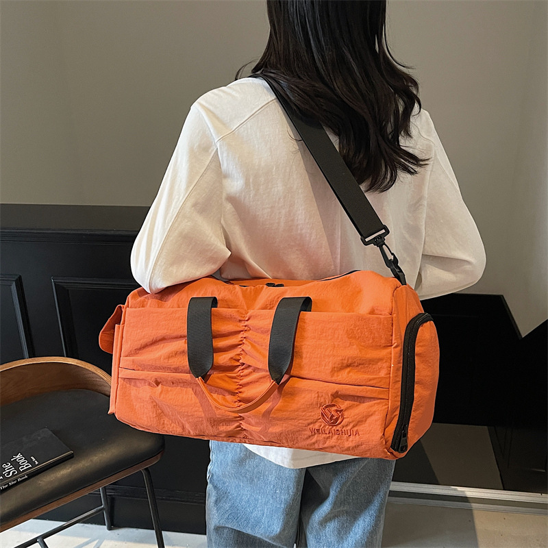 Nueva bolsa de viaje para mujeres, bolsa de fitness ligera, bolsa de yoga deportiva de moda, bolsa de mano secada y húmeda.