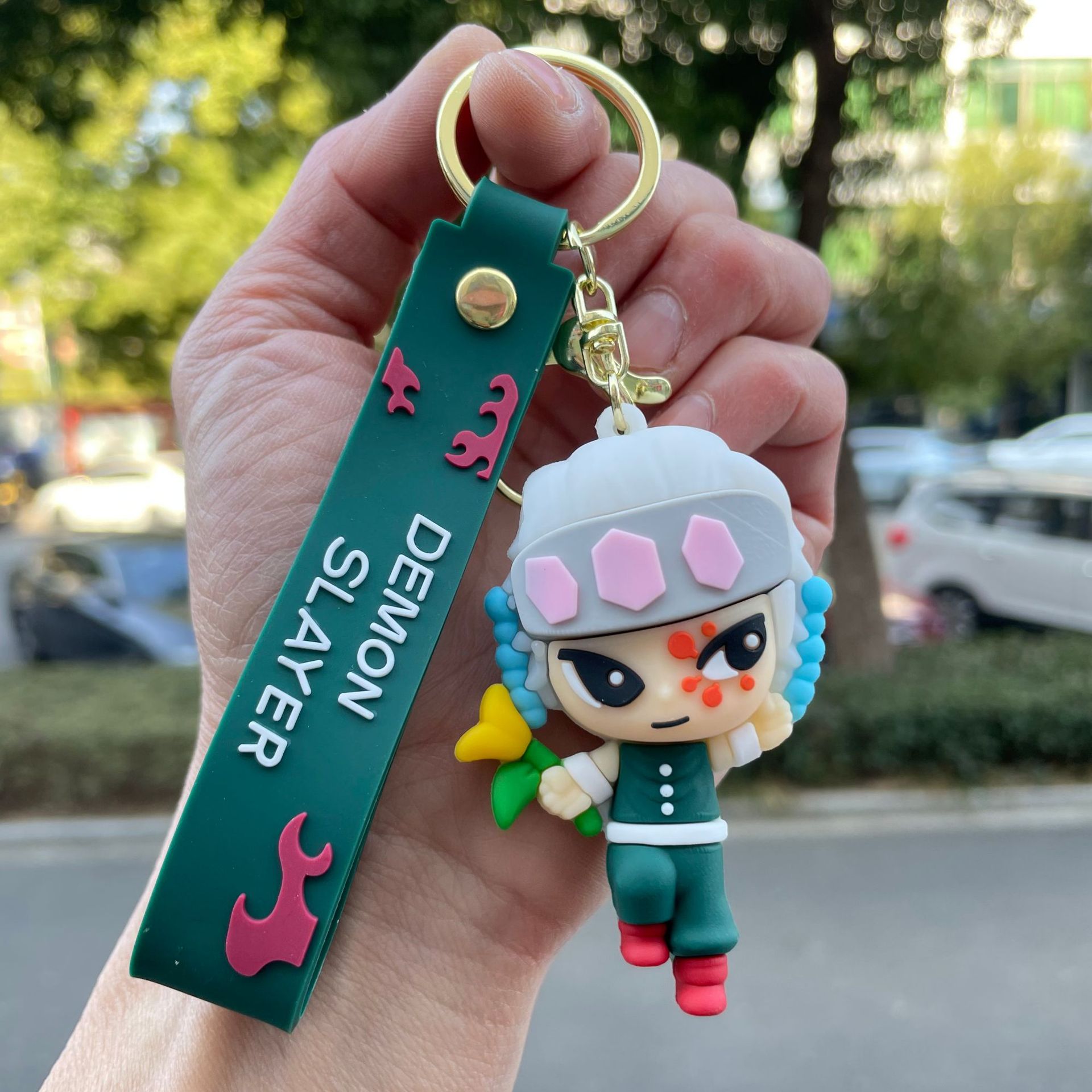 鬼滅の刃の鍵は自動車のキーチェーンの漫画の公仔のかばんのペンダントの子供機の小さい贈り物の卸売りを掛けます。