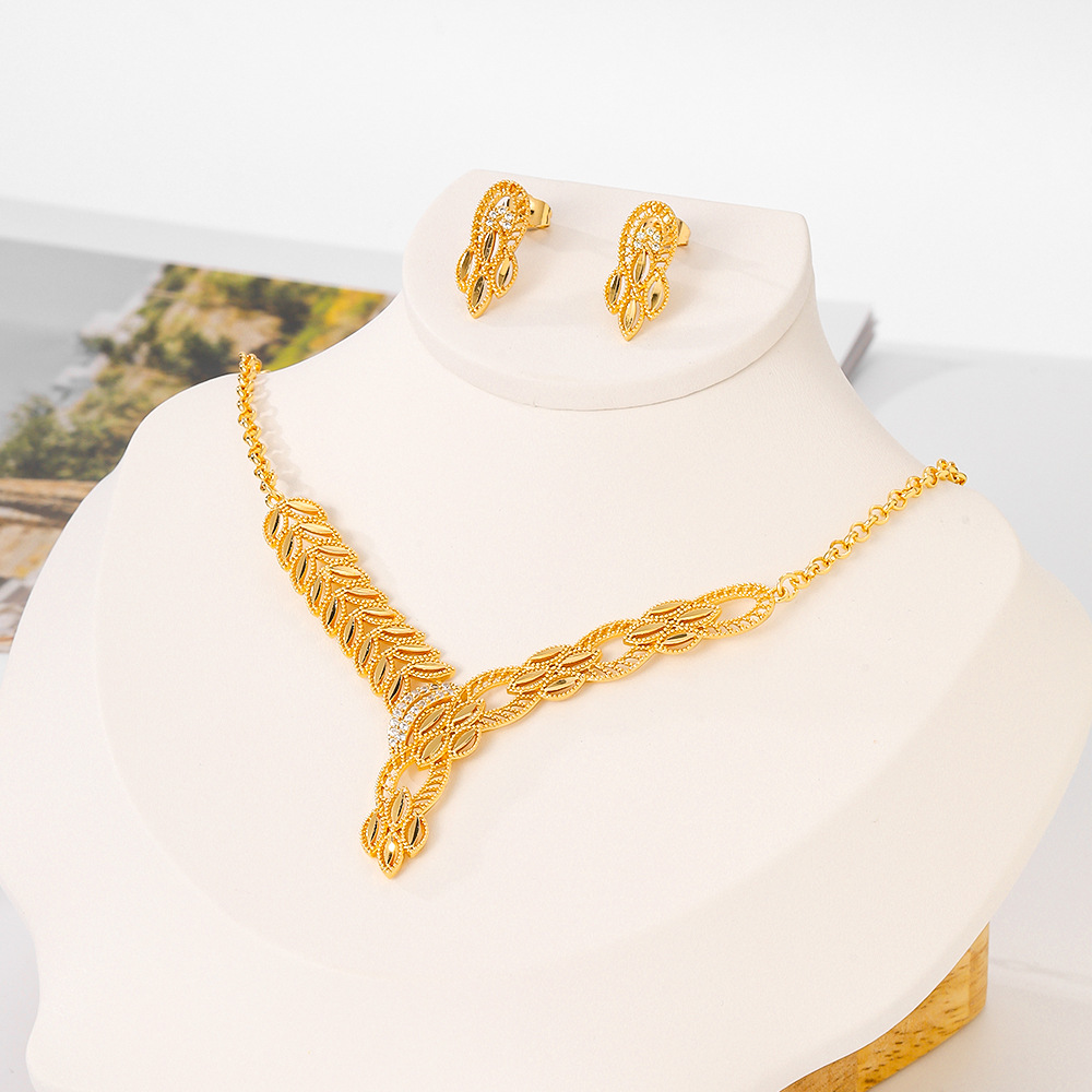 Joyería de moda europea y americana para mujeres bronce dorado pendientes de piedra de aluminio collar de dos piezas opciones de joyería transfronterizas