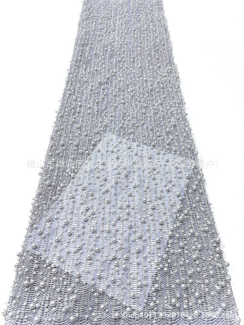 Tejido de malla de perlas hechas a mano de alto grado ondulado vertical tridimensional bordado de perlas vestido de boda tela de diseño