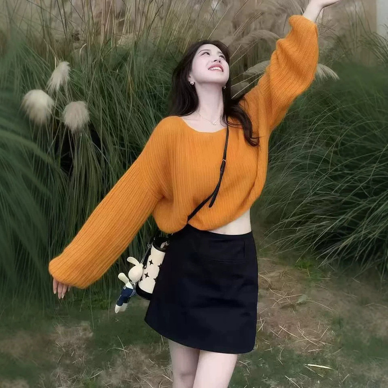 Korean-style, high-end pumpkin orange mohair knit sweater for women, featuring a soft, cozy, and relaxed fit, with lantern sleeves, perfect for autumn and winter