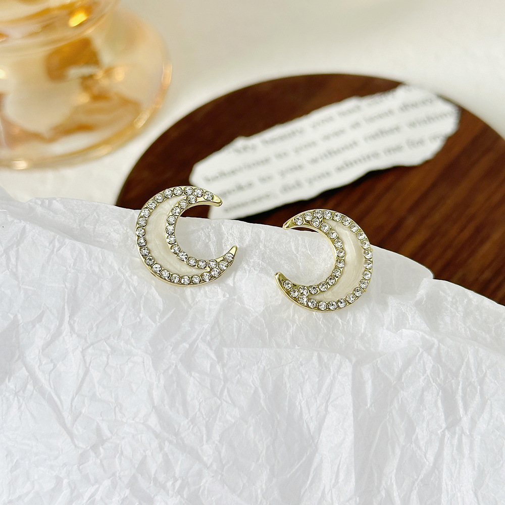 Aguja de plata de moda alta sensación de diamante de goteo de aceite pendientes nicho universal elegante pernos de orejas ligero lujoso temperamento simple orejas para mujeres