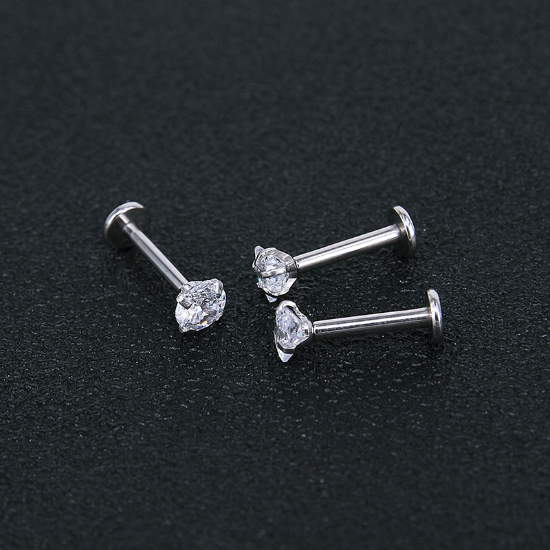 Silver pointed spike labret stud material detail