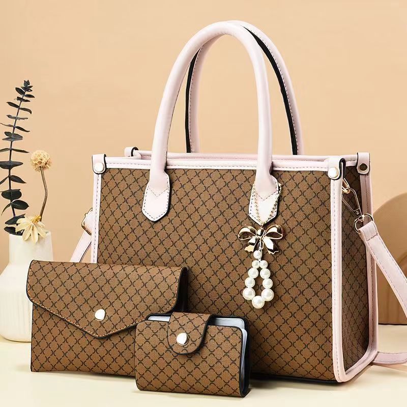 2026 nueva tendencia transfronteriza tres piezas paquete de bolsas para niños y madres, bolsas de mano portátiles de hombro simple y de gran capacidad