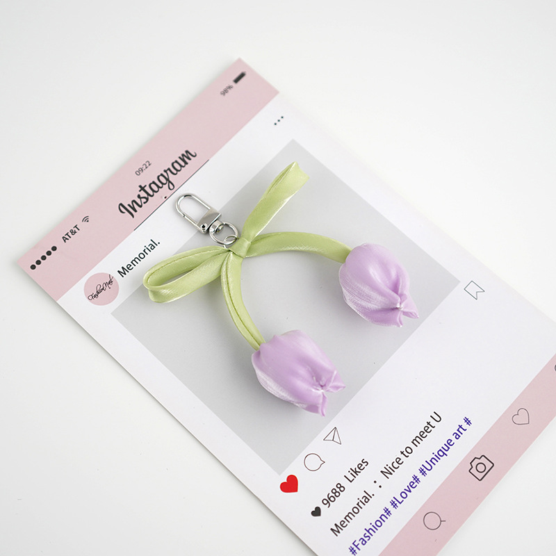 Venta caliente todo fósforo tulipán perla rosa serpentina arco púrpura colgante amor llavero bolso colgante