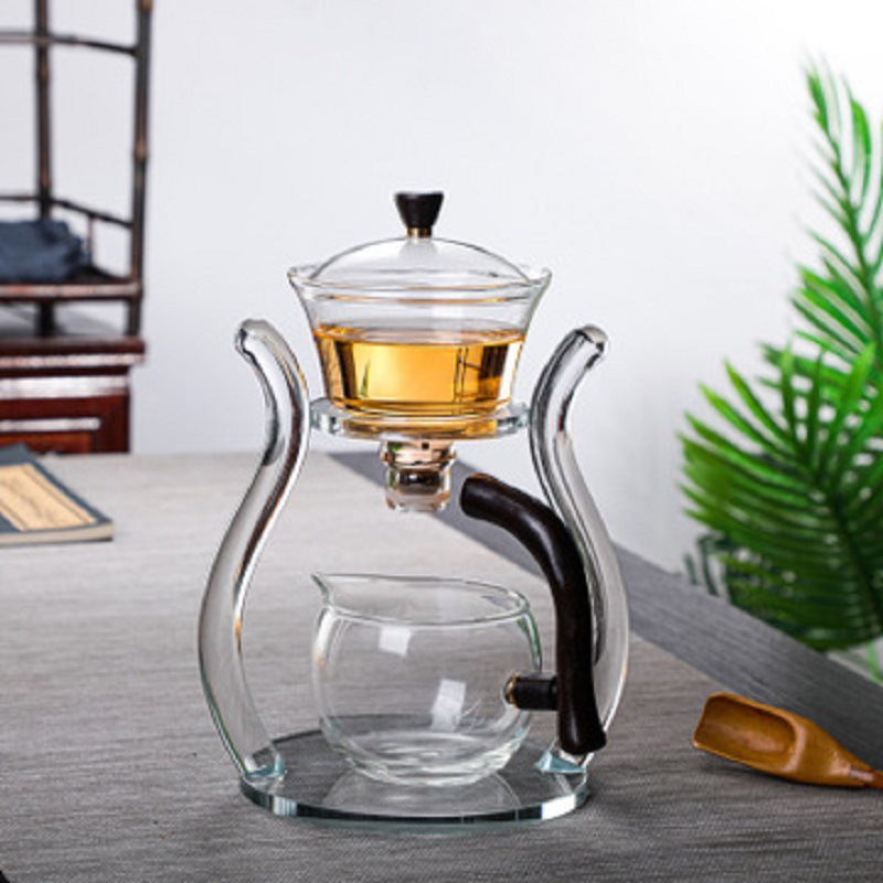 Fábrica al por mayor de vidrio transparente fabricante de té traje de succión magnética juego de té perezoso fabricante de té con soporte Palacio Lámpara juego de té traje