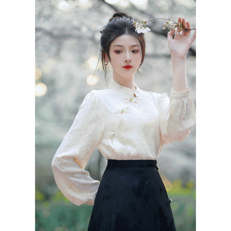 A modern Chinese-style shirt and skirt set, featuring a retro-inspired design for young women. The set includes a top and skirt with traditional Chinese buttons.