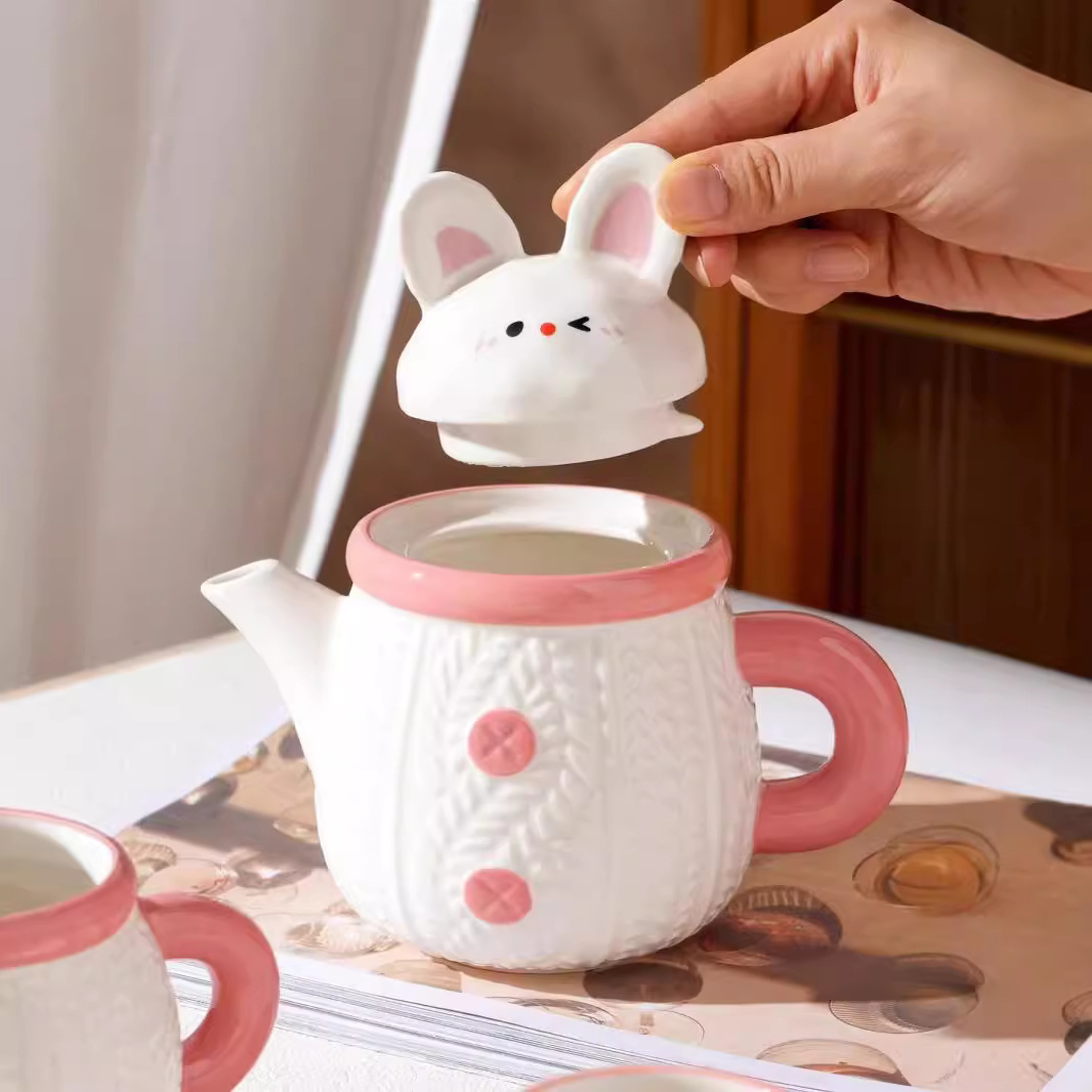Creativo y lindo conejo hervidor de cerámica taza de agua doméstica de alto valor de cara con regalo de mano para niñas con un conjunto de tazas de agua