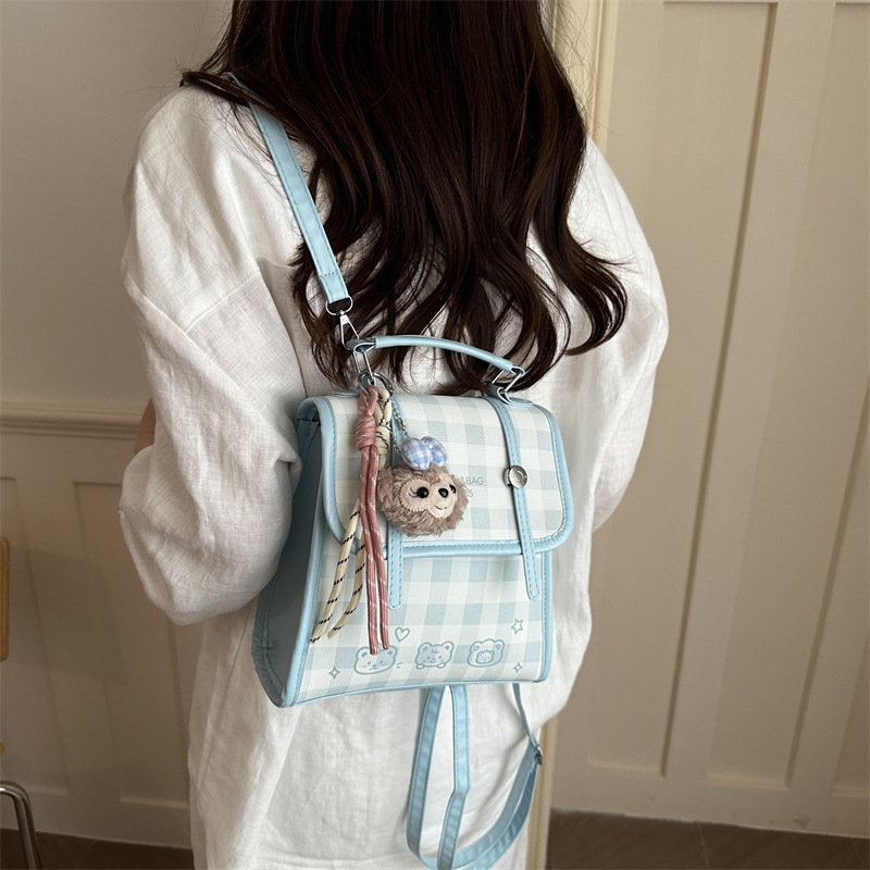 Modelo coreano de moda retro estriado mochila de hombro mujer2026 textura alta temperamento versátil mochila casual