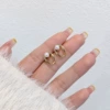 Small sophisticated golden earrings from pearl