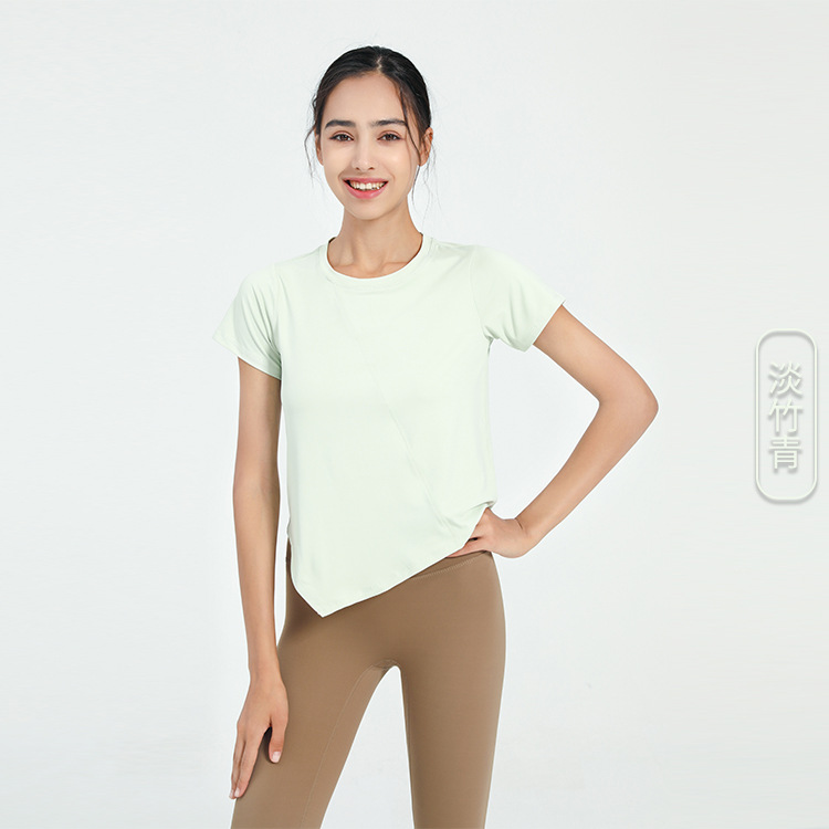 Nuevo verano suelto fitness deportes de manga corta Camiseta de mujer de color sólido europeo y americano de secado rápido irregular yoga Top blusa