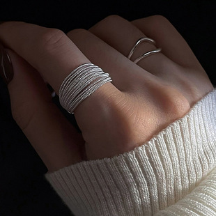 Minimalistic fashionable silver brand ring, on index finger