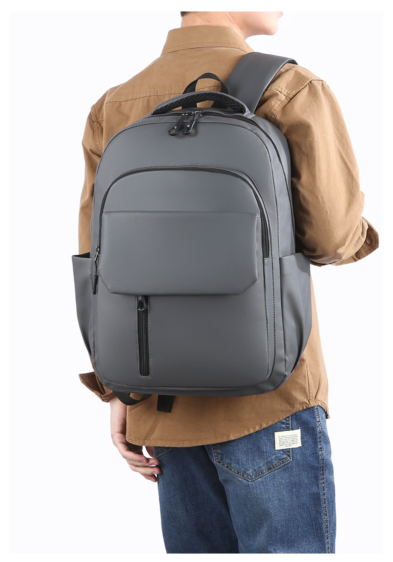Wholesale of in-stock commuting and business backpacks for men, simple and large-capacity USB charging laptop bags, and student schoolbags undefined
