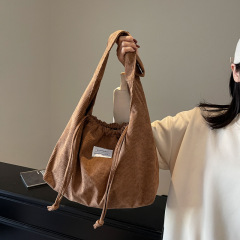 大容量トートバッグレディース2025新作バッグファッション百合シングルショルダーバッグ巾着デザイン通勤バッグ
