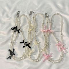 高級感亮白珍珠蝴蝶結綁帶斜跨手機掛鏈精緻ccd相機包包長款掛繩