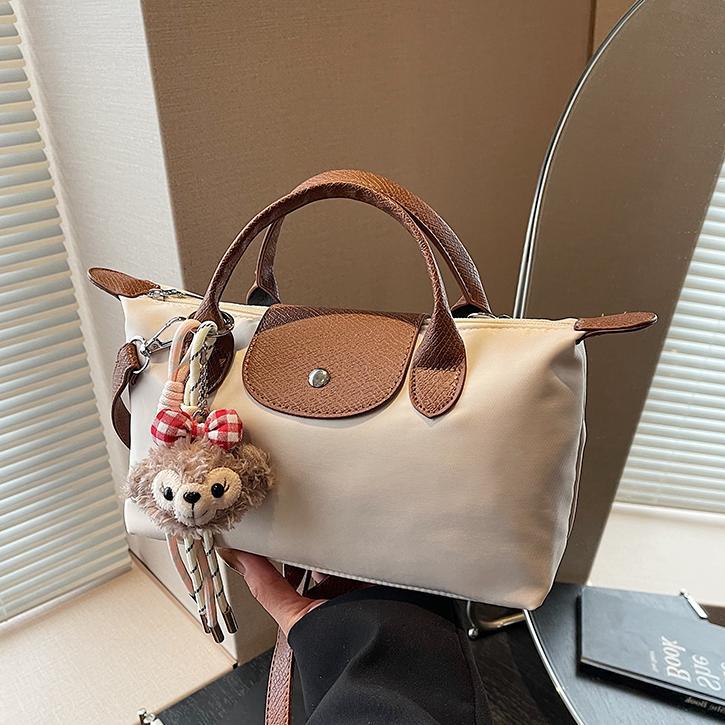 Bolsa de mano francesa de nicho Zhonglong para mujeres 2025 nuevo paquete de hombro casual universal para viajar bolso de alta calidad