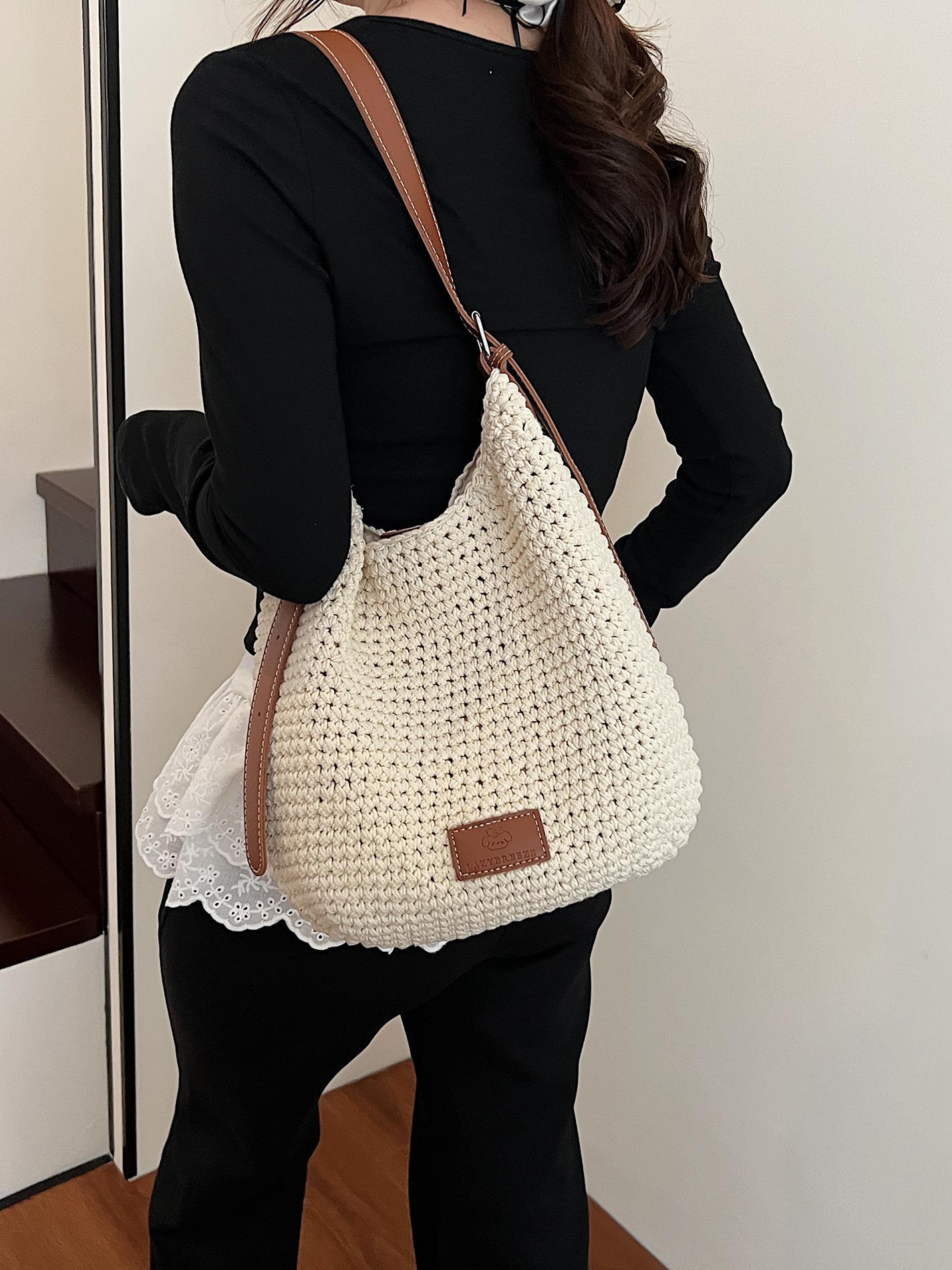 Bolso tejido hueco de estilo explosivo de verano para mujer de gran capacidad 2025 nuevo estilo de ocio junto al mar estilo vacaciones bolso tejido de paja de cercanías